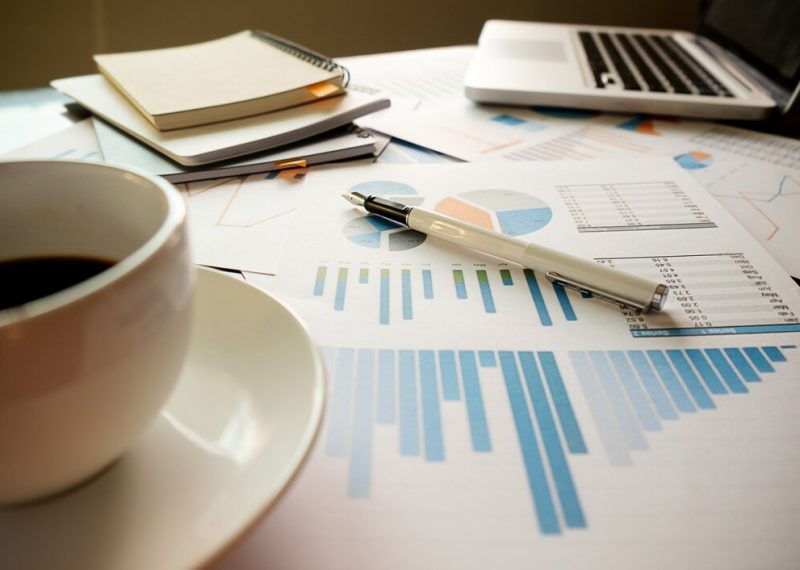 business-concept-with-copy-space-office-desk-table-with-pen-focus-analysis-chart-computer-notebook-cup-coffee-desk-vintage-tone-retro-filter-selective-focus_1418-680